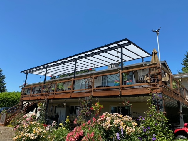 Acrylite patio cover with rain chains