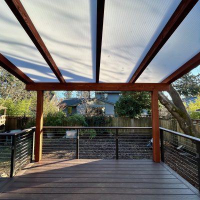 Wooden Framed Acrylite Cover and Trex Lava Rock Deck with Cable Railings and Lights