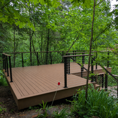 Trex deck with cable railing in the woods