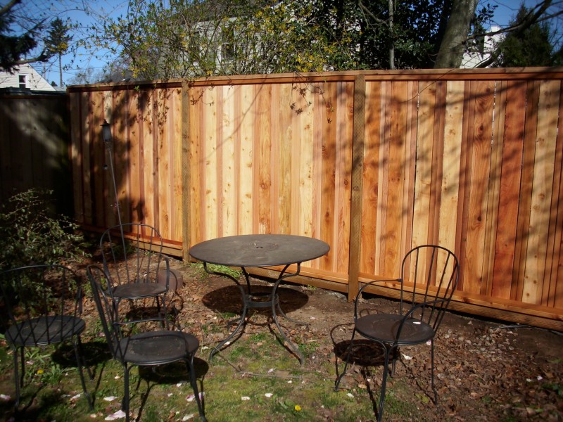 Custom cedar fence with tree feature | Deck Masters, LLC