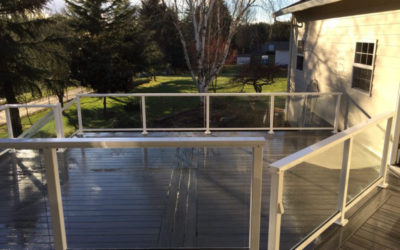 Composite deck with glass railing