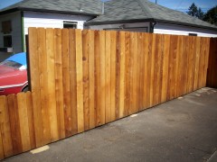 Dog ear cedar fence with semi transparent stain | Deck Masters, LLC